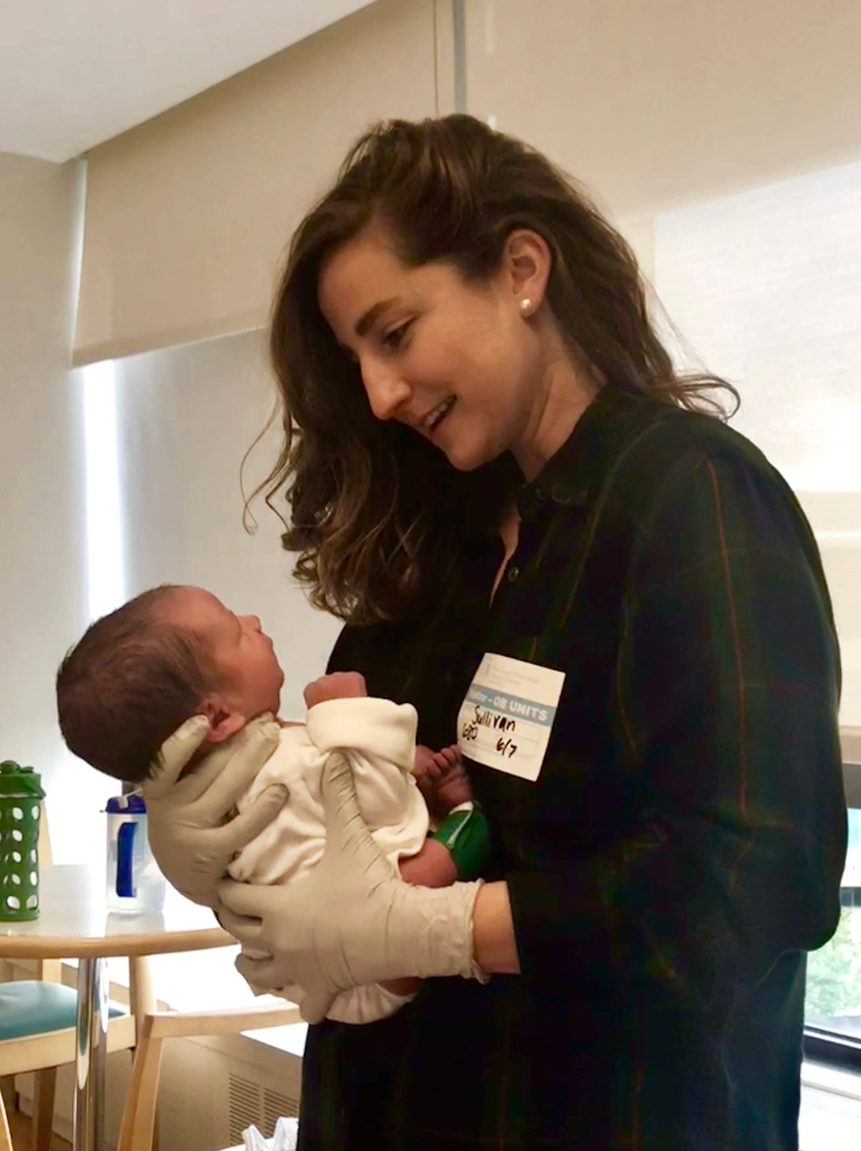 Laura holding a baby